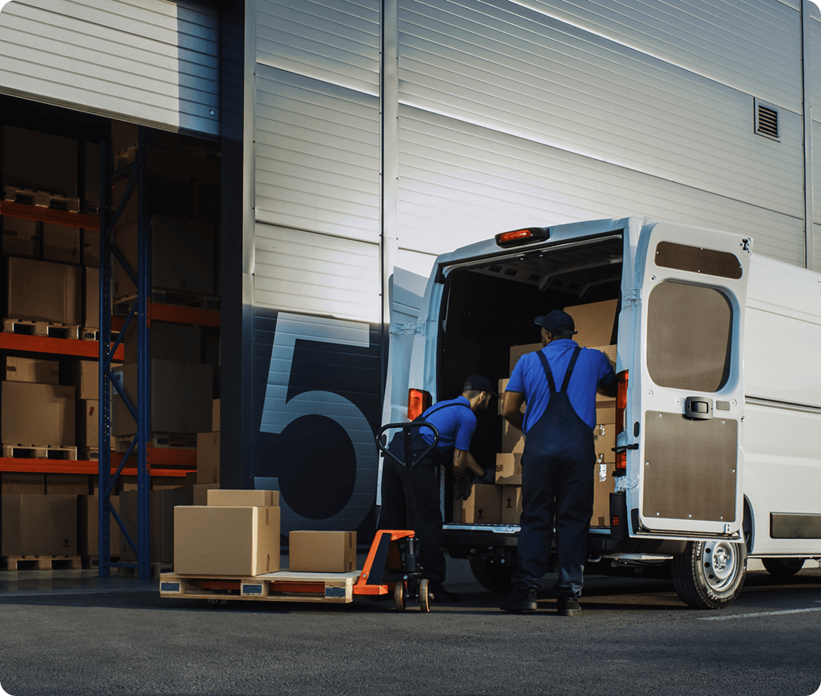 Warehouse staff organizing shipment boxes